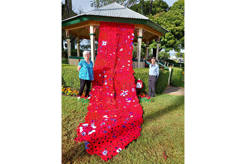 Sandgate QCWA Branch Treasurer Margaret Hay (right) and Vice President and Poppy Project Coordinator Anne Jenkins (left) with the completed display in Sandgate War Memorial Park on ANZAC Day 2025