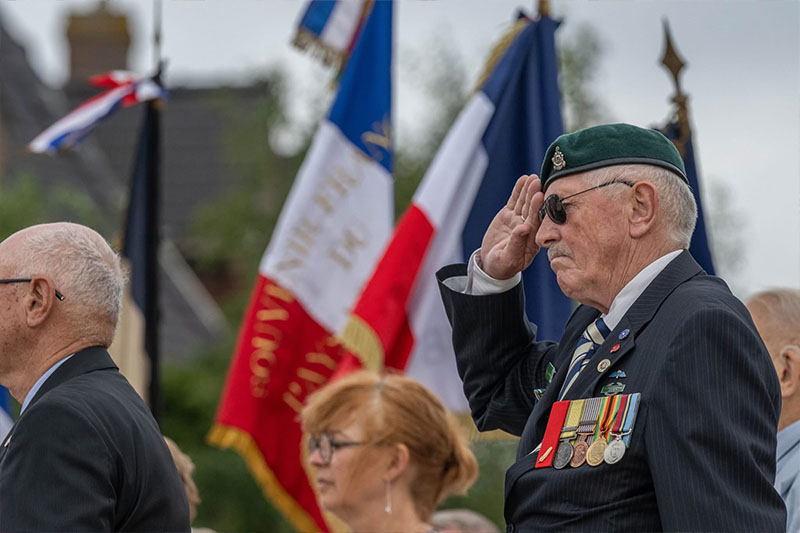 Person saluting with war medals